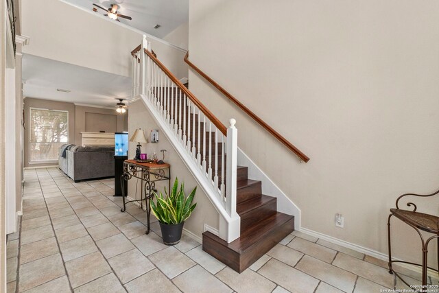 8807 Brae Crst, San Antonio, TX 78249 - staircase with ceiling fan, tile patterned floors, and baseboards