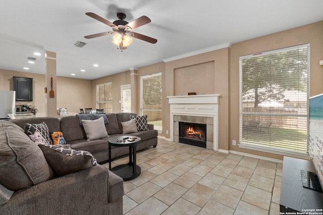 8807 Brae Crst, San Antonio, TX 78249 - living area with a ceiling fan, a tiled fireplace, plenty of natural light, recessed lighting, and baseboards