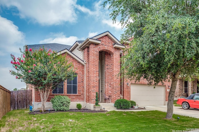traditional-style house featuring brick siding and concrete driveway