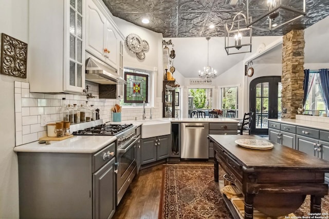 111 Kendall Oaks, Boerne, TX 78006 - kitchen featuring gray cabinets, appliances with stainless steel finishes, a sink, glass insert cabinets, and dark wood-style flooring