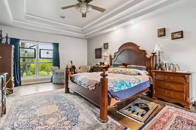 111 Kendall Oaks, Boerne, TX 78006 - bedroom with a tray ceiling, wood finished floors, ceiling fan, and recessed lighting