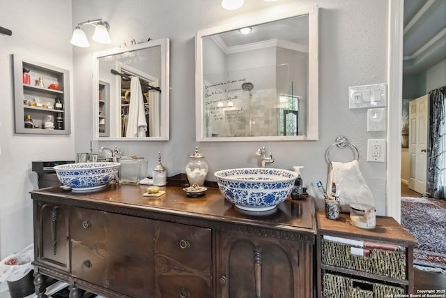 111 Kendall Oaks, Boerne, TX 78006 - full bathroom featuring crown molding, vanity, and tiled shower