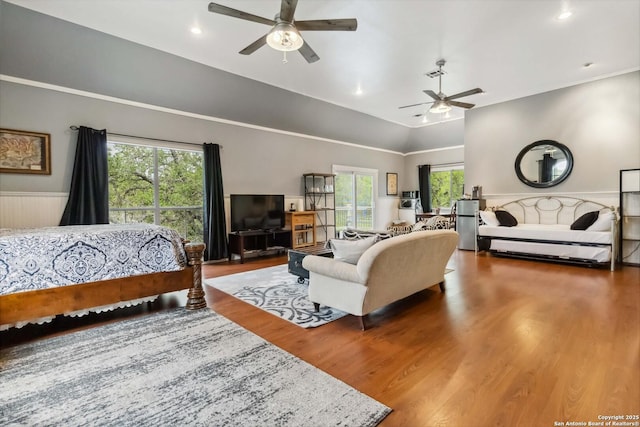 111 Kendall Oaks, Boerne, TX 78006 - bedroom featuring wood finished floors, multiple windows, wainscoting, lofted ceiling, and recessed lighting