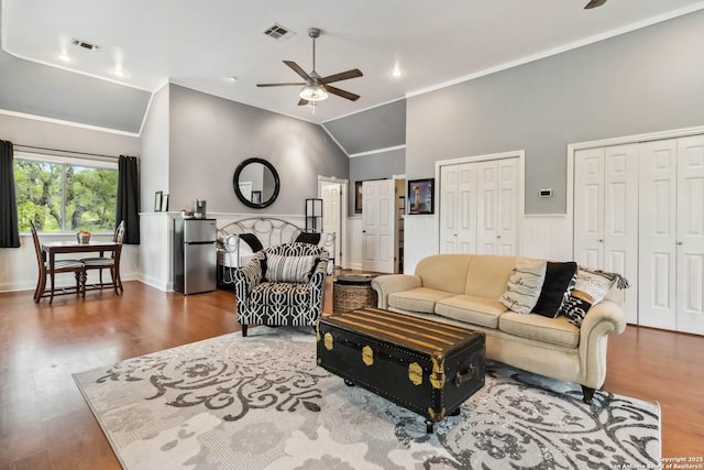 111 Kendall Oaks, Boerne, TX 78006 - living area with a ceiling fan, lofted ceiling, wood finished floors, ornamental molding, and a wainscoted wall
