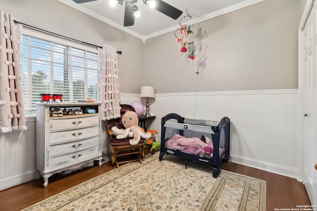 111 Kendall Oaks, Boerne, TX 78006 - bedroom with a wainscoted wall, ornamental molding, wood finished floors, and ceiling fan