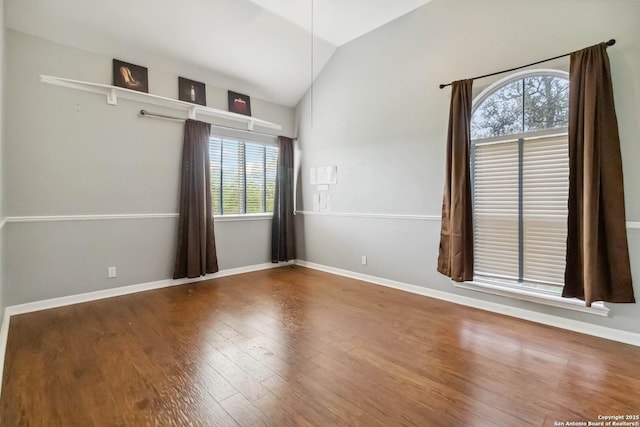 111 Kendall Oaks, Boerne, TX 78006 - unfurnished room with lofted ceiling, wood finished floors, and baseboards