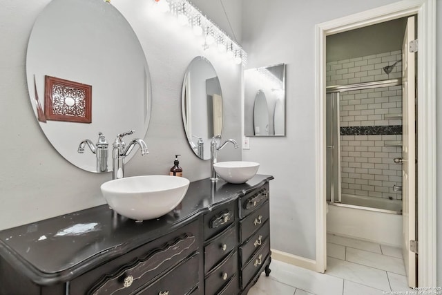 111 Kendall Oaks, Boerne, TX 78006 - bathroom featuring double vanity, enclosed tub / shower combo, and baseboards