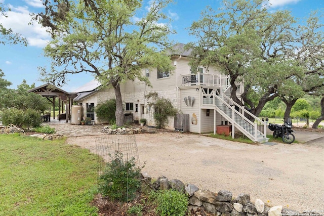 111 Kendall Oaks, Boerne, TX 78006 - back of house featuring stairway and stone siding