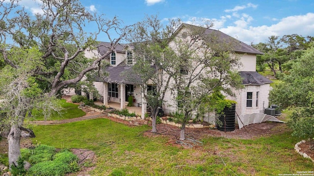 111 Kendall Oaks, Boerne, TX 78006 - view of front of property featuring a front yard, a patio, central AC unit, and roof with shingles