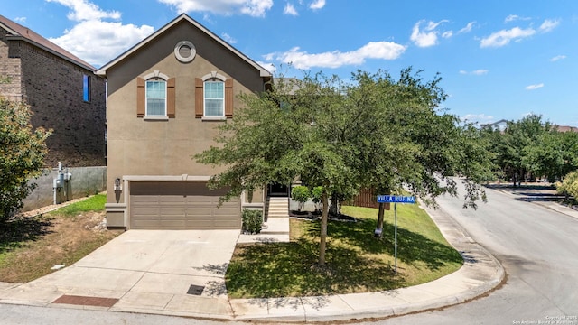 2527 Villa Rufina, San Antonio, TX 78259 - view of front of house featuring stucco siding, an attached garage, and driveway