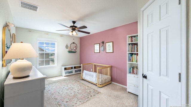 2527 Villa Rufina, San Antonio, TX 78259 - carpeted bedroom with a crib, baseboards, and a ceiling fan