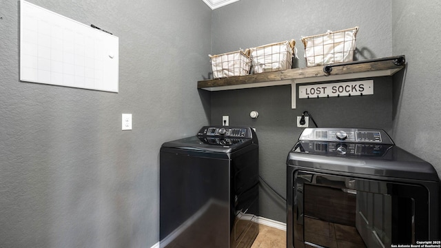 2527 Villa Rufina, San Antonio, TX 78259 - washroom featuring washer and clothes dryer, wood finished floors, a textured wall, and baseboards