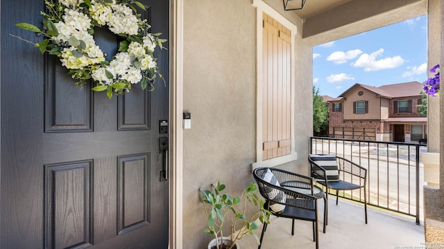 2527 Villa Rufina, San Antonio, TX 78259 - view of exterior entry featuring stucco siding and a balcony