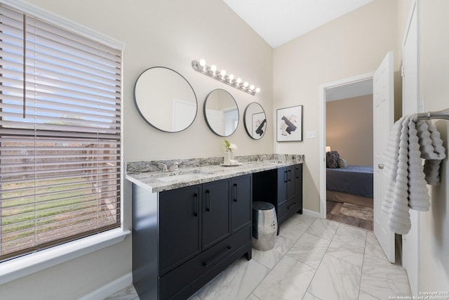 11302 Cedar Park, San Antonio, TX 78249 - ensuite bathroom featuring marble finish flooring, double vanity, and baseboards