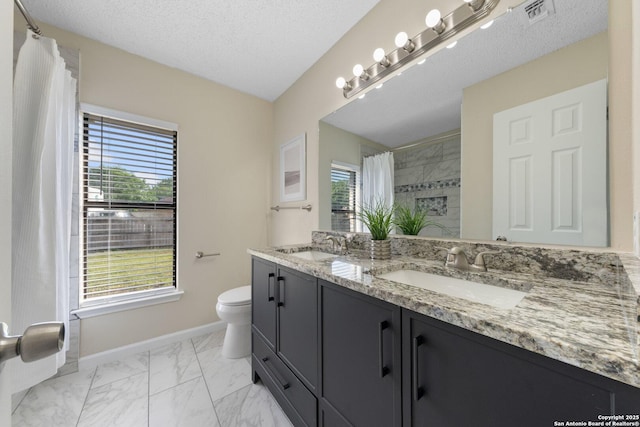 11302 Cedar Park, San Antonio, TX 78249 - full bath with toilet, marble finish floors, baseboards, double vanity, and a shower with shower curtain