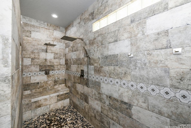 23018 Osprey, San Antonio, TX 78260 - full bathroom featuring a tile shower and a textured ceiling