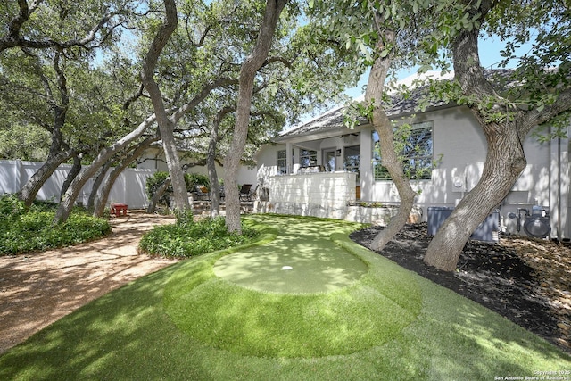 23018 Osprey, San Antonio, TX 78260 - view of yard with a putting area and fence