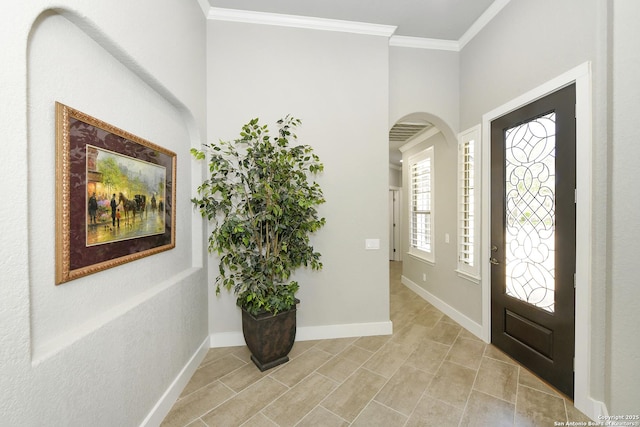 23018 Osprey, San Antonio, TX 78260 - foyer featuring arched walkways, ornamental molding, light tile patterned floors, and baseboards