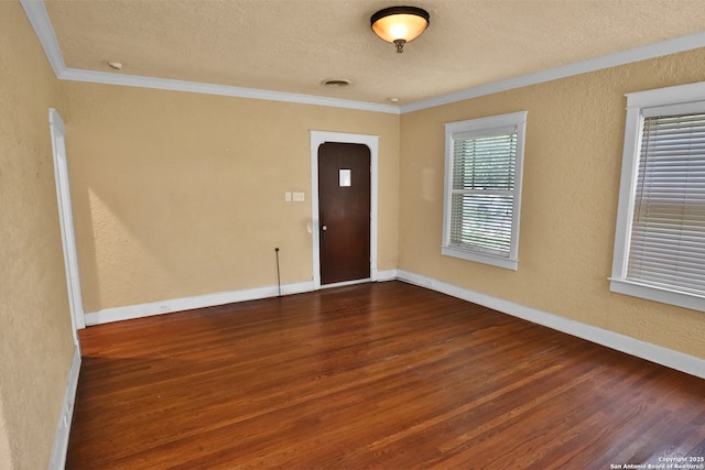 1919 W Magnolia Ave, San Antonio, TX 78201 - foyer entrance featuring wood finished floors, ornamental molding, a textured ceiling, baseboards, and a textured wall