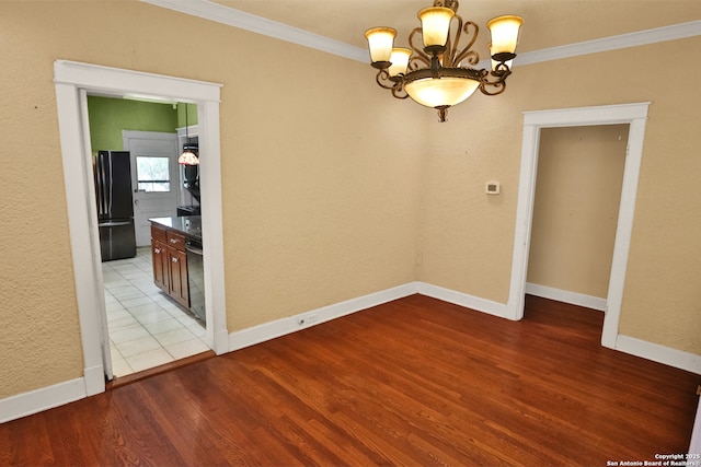 1919 W Magnolia Ave, San Antonio, TX 78201 - empty room with ornamental molding, a chandelier, wood finished floors, and baseboards