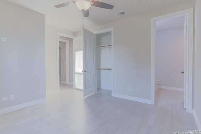 4862 Blue Jasmin, San Antonio, TX 78245 - unfurnished bedroom featuring a closet, light wood finished floors, baseboards, a ceiling fan, and connected bathroom