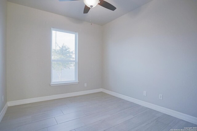 4862 Blue Jasmin, San Antonio, TX 78245 - spare room featuring ceiling fan, wood finished floors, and baseboards