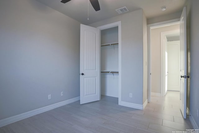 4862 Blue Jasmin, San Antonio, TX 78245 - unfurnished bedroom with a closet, wood finished floors, baseboards, and a ceiling fan