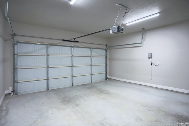 4862 Blue Jasmin, San Antonio, TX 78245 - garage with a garage door opener and baseboards
