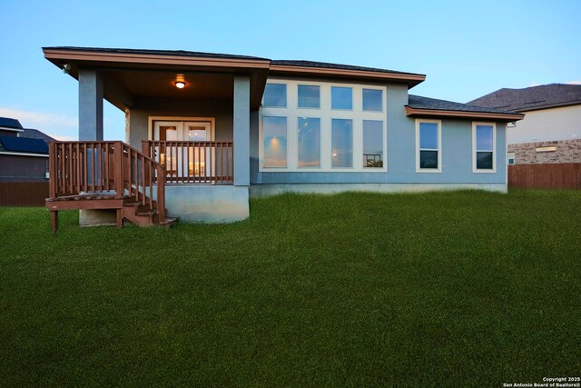 4862 Blue Jasmin, San Antonio, TX 78245 - rear view of property featuring a porch and stucco siding