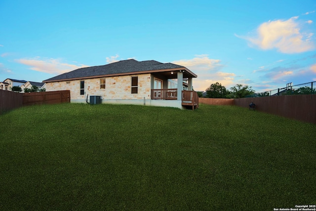 4862 Blue Jasmin, San Antonio, TX 78245 - rear view of property featuring stone siding and cooling unit
