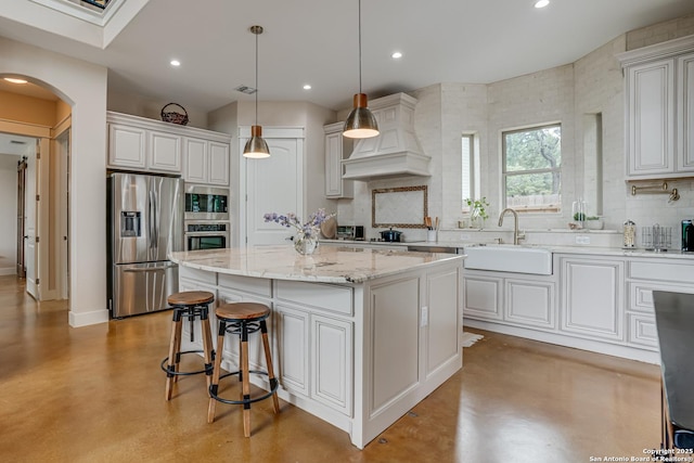 2191 Grandview Frst, Canyon Lake, TX 78133 - kitchen featuring stainless steel appliances, concrete floors, a sink, premium range hood, and recessed lighting