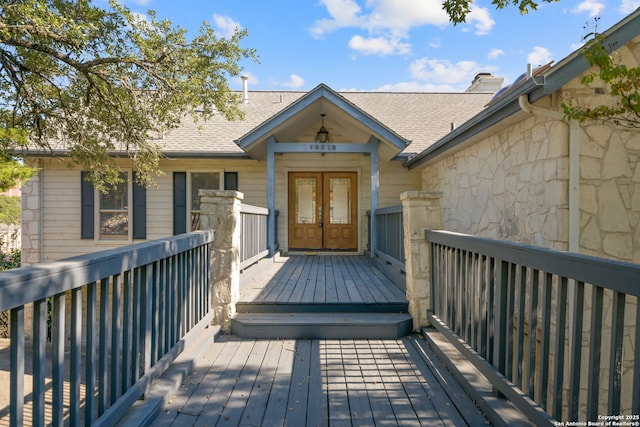 19318 Strauss, San Antonio, TX 78256 - entrance to property with french doors, stone siding, a wooden deck, and roof with shingles