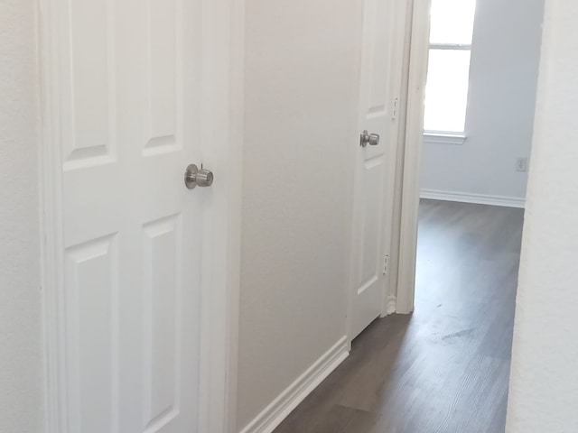 8610 James, Somerset, TX 78069 - hallway with baseboards and dark wood-style floors