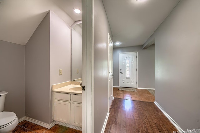 13811 Sunny Gln, San Antonio, TX 78217 - bathroom featuring toilet, baseboards, vanity, and wood finished floors