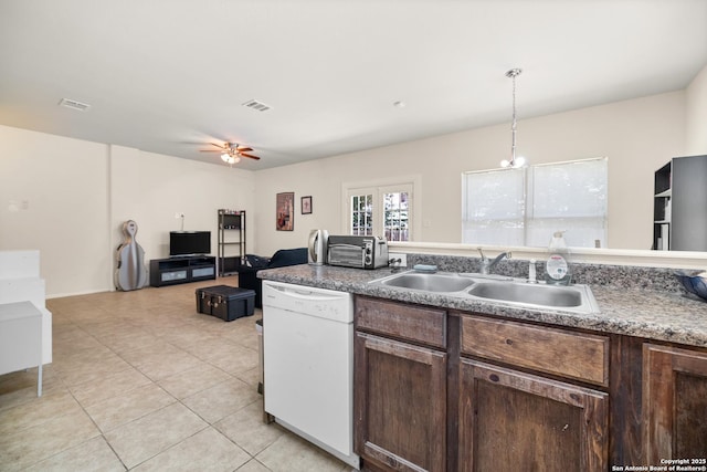 17 Oak Plz, San Antonio, TX 78216 - kitchen with white dishwasher, a sink, light tile patterned floors, dark brown cabinets, and a ceiling fan