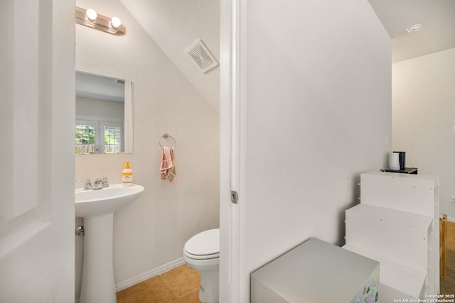 17 Oak Plz, San Antonio, TX 78216 - half bathroom with toilet, a sink, baseboards, and tile patterned floors