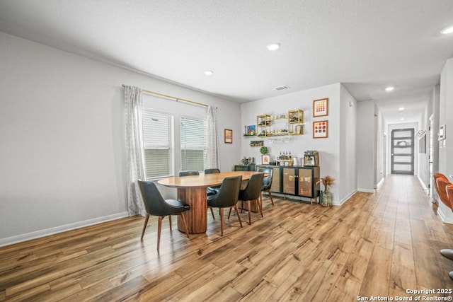 25826 Marigold Oaks, Boerne, TX 78006 - dining room with light wood-style flooring, baseboards, and recessed lighting