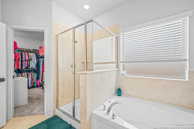 25826 Marigold Oaks, Boerne, TX 78006 - bathroom featuring a stall shower, a walk in closet, tile patterned floors, a garden tub, and recessed lighting