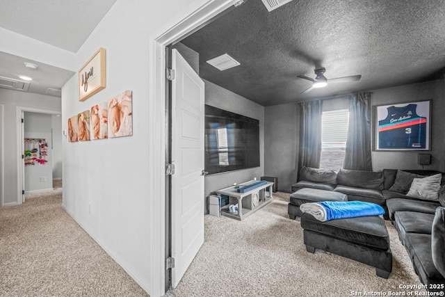 25826 Marigold Oaks, Boerne, TX 78006 - carpeted living area with a ceiling fan, baseboards, a textured ceiling, and attic access