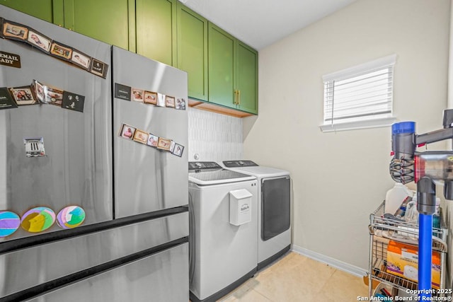 25826 Marigold Oaks, Boerne, TX 78006 - washroom with cabinet space, washer and clothes dryer, baseboards, and light tile patterned floors