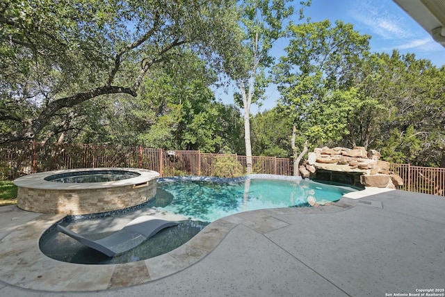 51 Stonewall Bnd, San Antonio, TX 78256 - view of swimming pool with fence, a pool with connected hot tub, and a patio area