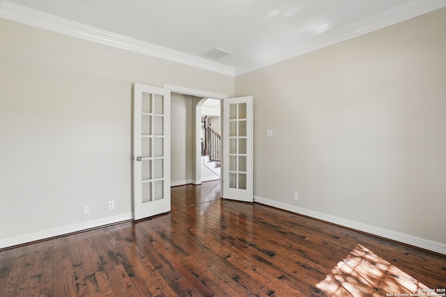 51 Stonewall Bnd, San Antonio, TX 78256 - empty room featuring french doors, arched walkways, crown molding, wood finished floors, and baseboards
