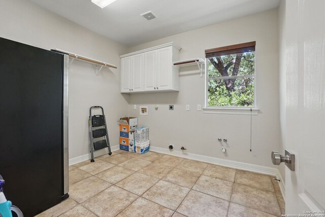 51 Stonewall Bnd, San Antonio, TX 78256 - laundry room with hookup for a gas dryer, hookup for an electric dryer, washer hookup, cabinet space, and baseboards
