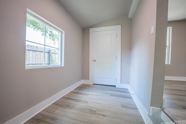 312 Avondale, San Antonio, TX 78223 - hall with vaulted ceiling, light wood-style flooring, and baseboards