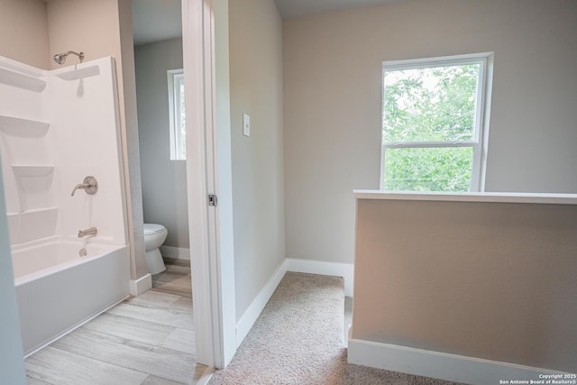 312 Avondale, San Antonio, TX 78223 - bathroom featuring toilet, shower / bathtub combination, and baseboards