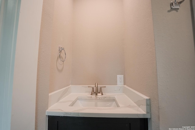 312 Avondale, San Antonio, TX 78223 - bathroom featuring a textured wall and vanity