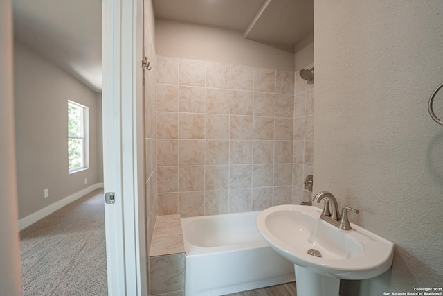 312 Avondale, San Antonio, TX 78223 - bathroom featuring a sink, washtub / shower combination, and baseboards