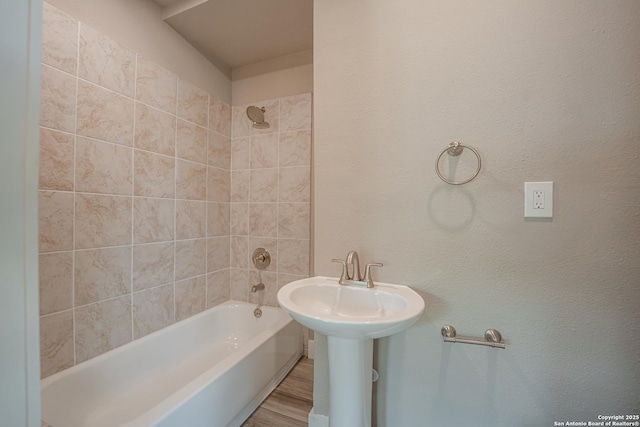 312 Avondale, San Antonio, TX 78223 - bathroom with tub / shower combination and wood finished floors