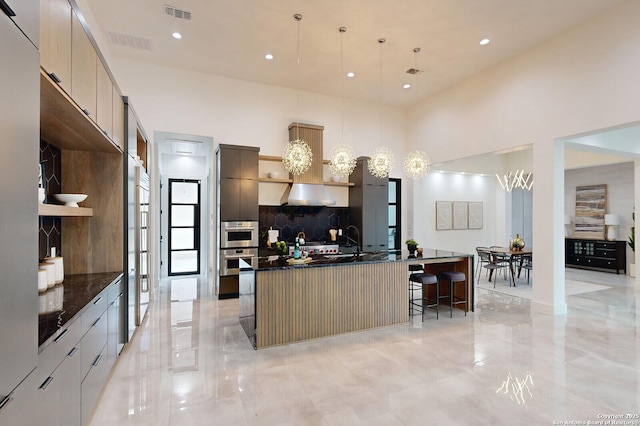 1356 Capitare, New Braunfels, TX 78132 - kitchen with modern cabinets, decorative backsplash, a large island, a sink, and recessed lighting