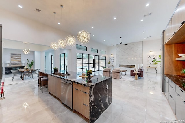 1356 Capitare, New Braunfels, TX 78132 - kitchen featuring modern cabinets, a sink, dishwasher, recessed lighting, and dark stone counters